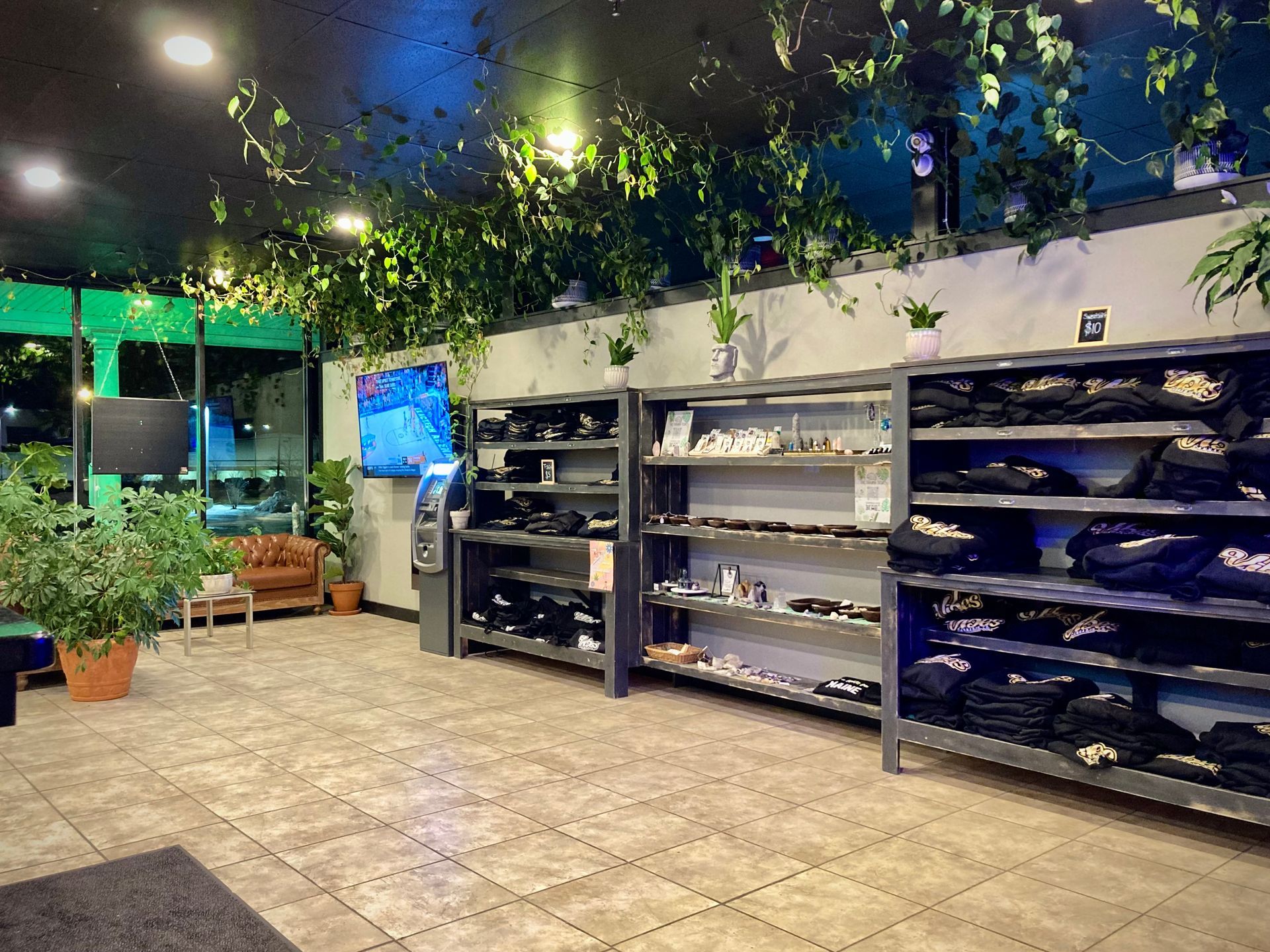 Merch shelves and lounge seating in the Vibes Cannabis Co showroom in Bangor, Maine
